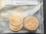three gold coins in a plastic bag on a table