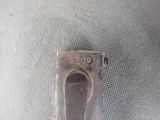 a metal object that is sitting on top of a cloth