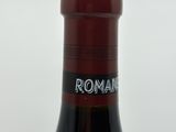 a bottle of wine that is sitting on a table