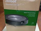 le carton du robot aspirateur est posé sur la table