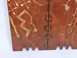 a wooden cabinet with a design on it