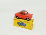 a red toy car sitting on top of a yellow box
