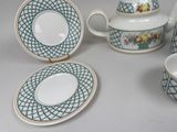 a tea set with a tea pot and a tea cup