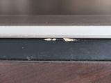 a close up view of a laptop computer on a wooden table