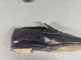 two pairs of shoes that are on the floor