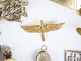 a lot of gold and silver jewelry on a white surface