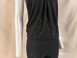 a mannequin wearing a black top and leggings on a mannequin mannequin