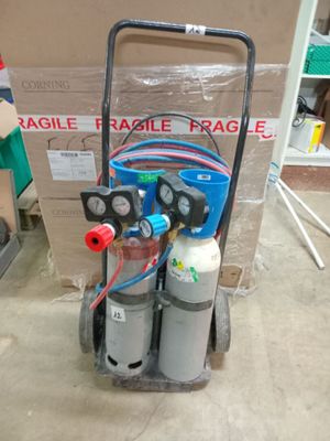 une image représentant un chariot sur lequel sont posés deux réservoirs