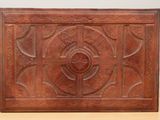 an old wooden box sitting on top of a table next to a wall