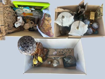 two boxes with different items in them on a table