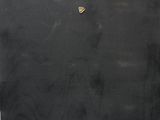 an oil painting of a black board with a piece of paper sticking out of it