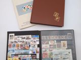 three different types of stamps are in a folder on a table