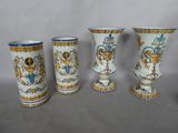 three vases with designs on them are sitting on a table