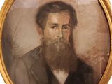 portrait d'un homme barbu dans un cadre en or