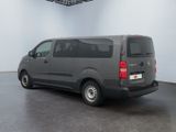 the van is parked in the empty room of the building