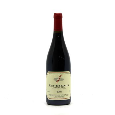 a close up of a bottle of red wine on a white background