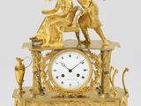 une image représentant une horloge en or surmontée d'un ange