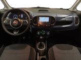 the interior of a small car with a steering wheel, dashboard, and dashboard lights