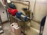 a room with a lot of pipes and a lot of water