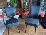two chairs and a ottoman in a living room with a plant