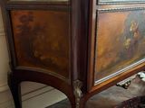 a cabinet that has a clock on top of it