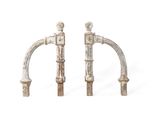 pair of antique cast iron door handles with a white background