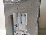 boxed box of a blender sitting on a table with the lid open