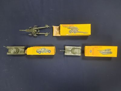 three toy army vehicles are lined up next to each other