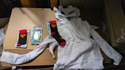 a cardboard box with a stuffed animal and a pair of socks on it