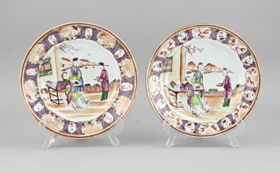 pair of chinese porcelain plates with figures on them on stands