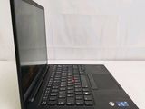 the laptop is open on a white surface with a black keyboard