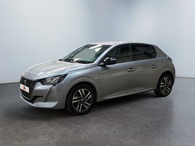 a silver car is parked in a room with a white wall