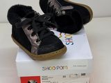 a pair of shoes that are on top of a box