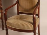 pair of antique mahogany chairs with upholstered upholstered arms