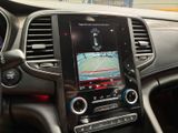 the dashboard of a car with a gps device in the center