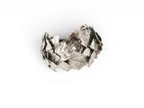 an image of a close up of a silver ring on a white surface