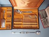 many silverware in a case on the table