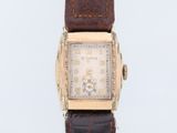 an image of a wrist watch with a brown leather strap