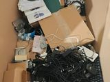 a cardboard box full of electronic devices and electronics