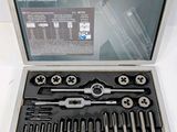 an image of a set of tools in a case on a table