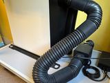 a laptop computer and a blow dryer on a desk