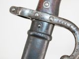 a close up of a sword with a metal handle