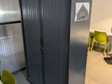 a large metal cabinet in the middle of a room