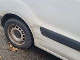 a white van that is parked on the side of the road