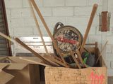 a box full of baseball bats and a clock in it