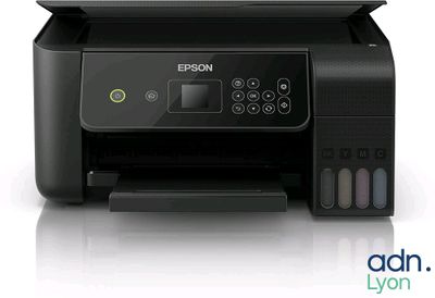 a black printer sitting on top of a white surface