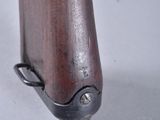 an image of a close up of a rifle on a white surface