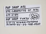 a sign on the refrigerator that says pop shop nyc