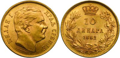 a close up of a gold coin with a crown on it