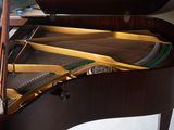 a piano that is sitting in the corner of a room